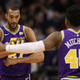 Rudy Gobert No. 27 of the Utah Jazz is congratulated by Donovan Mitchell No. 45 after scoring against the Phoenix Suns during the first half of the NBA game at Talking Stick Resort Arena on March 13, 2019 in Phoenix, Arizona.